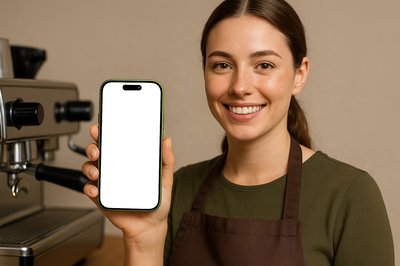 Barista Holding a Green Phone with White Screen
