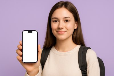 Student Holding a Purple Phone Against a Purple Background