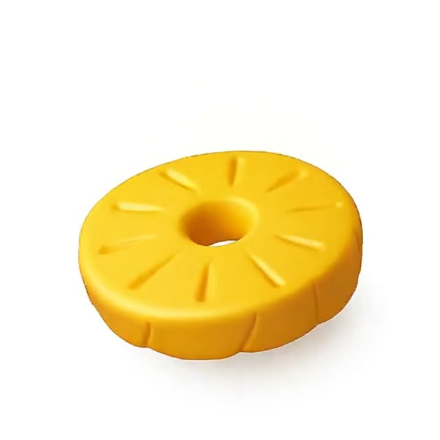 Colorful Yellow Rubber Toy Shapes on White Background