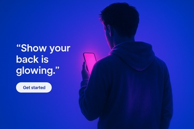 Person Holding a Glowing Phone Against a Blue Background
