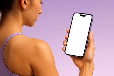 Sporty Woman Holding a Smartphone with a Blank Screen