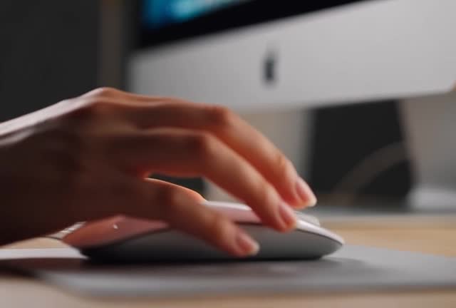 Close-up of Hands Using a Computer Mouse in Stock Footage