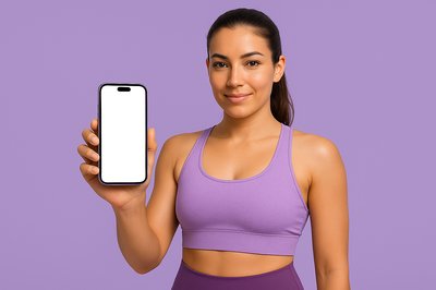 Fitness Trainer Holding a Phone in Purple Attire