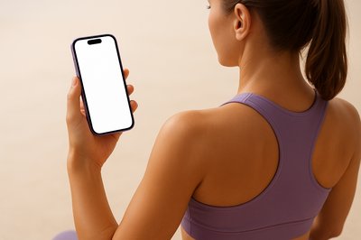 Yoga Instructor Holding a Purple Phone in Dynamic Pose